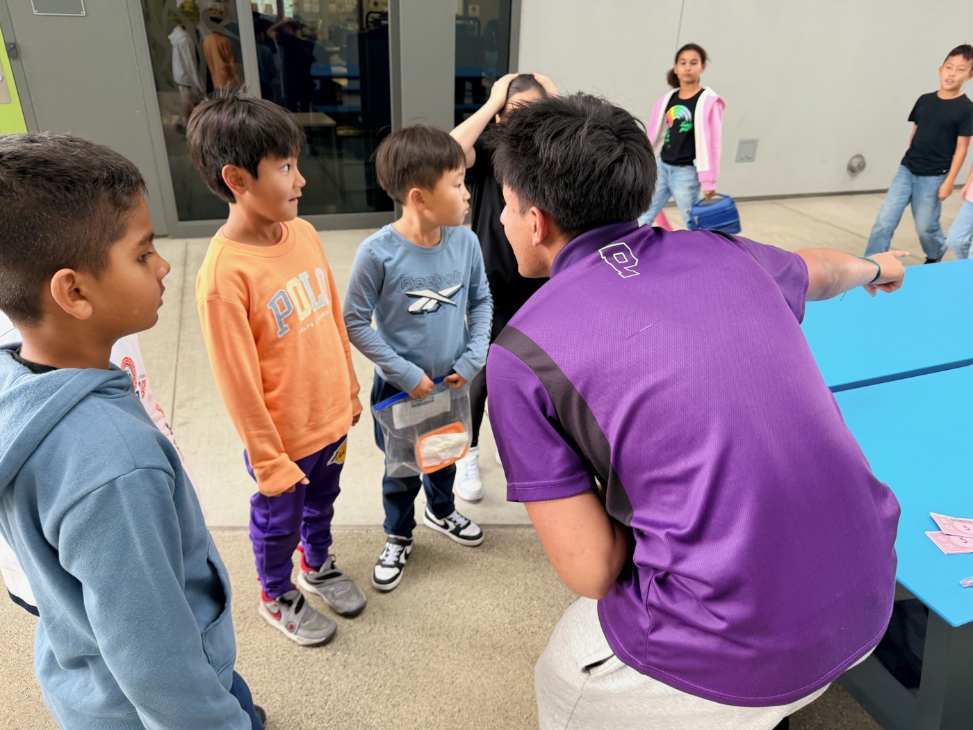 Students working with kids in small groups